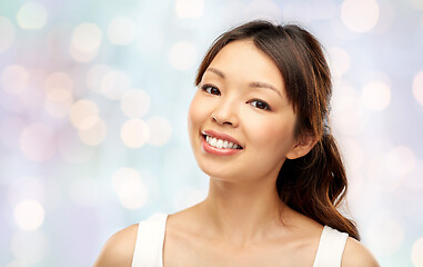 Image showing face of happy smiling young asian woman