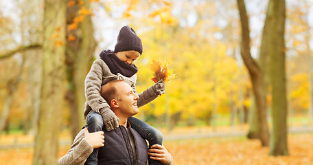 Image showing happy family having fun in autumn park