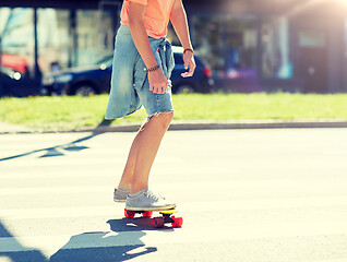 Image showing teenage boy on skateboard crossing city crosswalk