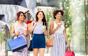 Image showing women with shopping bags and drinks in city