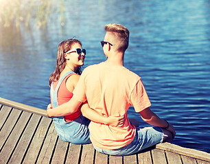 Image showing happy teenage couple hugging on river berth