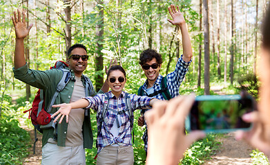 Image showing friends with backpacks being photographed on hike