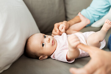 Image showing middle aged father playing with baby at home