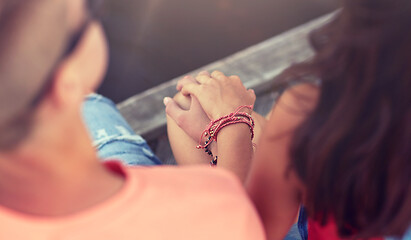 Image showing close up of happy teenage couple hands