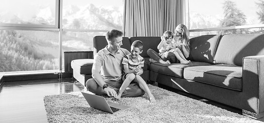 Image showing Happy family playing a video game