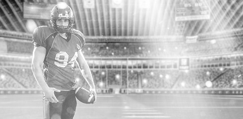 Image showing American Football Player isolated on big modern stadium field