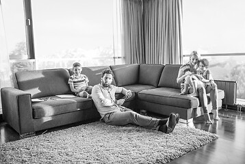 Image showing Happy Young Family Playing Together on sofa