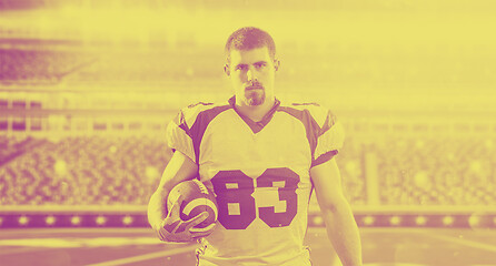 Image showing American Football Player isolated on big modern stadium field