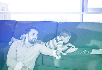 Image showing Happy Young Family Playing Together on sofa