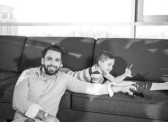 Image showing Happy Young Family Playing Together on sofa