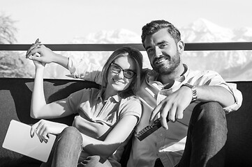 Image showing Young couple watching television