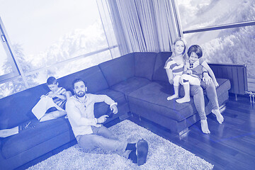 Image showing Happy Young Family Playing Together on sofa