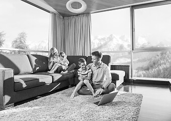 Image showing Happy family playing a video game