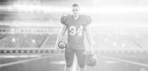 Image showing American Football Player isolated on big modern stadium field