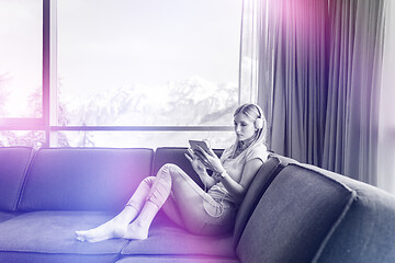 Image showing young girl enjoying music through headphones