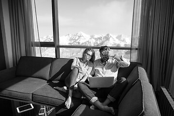 Image showing couple relaxing at  home using laptop computers