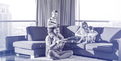 Image showing Happy family playing a video game