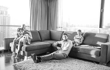 Image showing Happy Young Family Playing Together on sofa