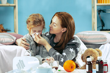 Image showing Sick woman with daughter at home. The ill family.