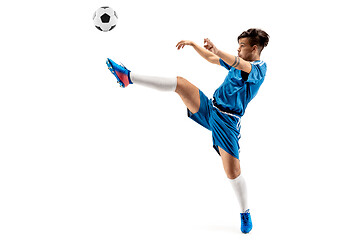 Image showing Young boy with soccer ball doing flying kick