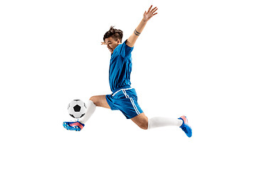 Image showing Young boy with soccer ball doing flying kick