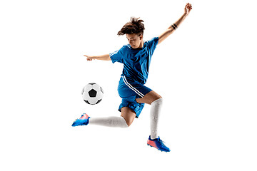 Image showing Young boy with soccer ball doing flying kick