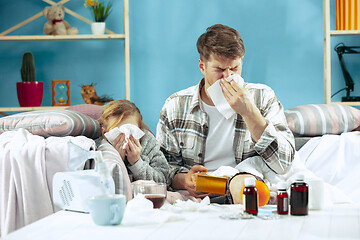 Image showing Sick man with daughter at home. The ill family.