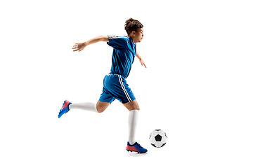 Image showing Young boy with soccer ball doing flying kick