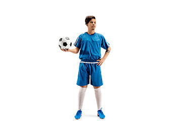 Image showing Young fit boy with soccer ball standing isolated on white