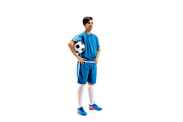 Image showing Young fit boy with soccer ball standing isolated on white