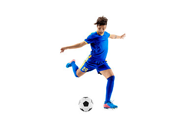 Image showing Young boy with soccer ball doing flying kick