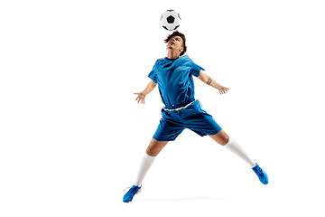 Image showing Young boy with soccer ball doing flying kick