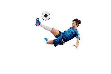 Image showing Young boy with soccer ball doing flying kick