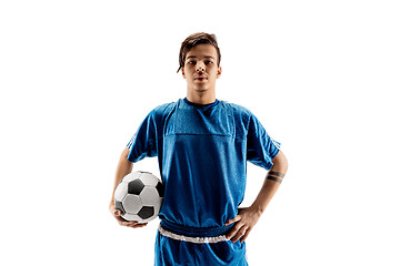 Image showing Young fit boy with soccer ball standing isolated on white