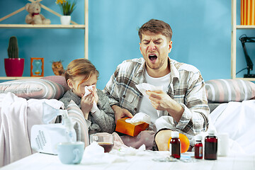 Image showing Sick man with daughter at home. The ill family.