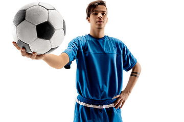 Image showing Young fit boy with soccer ball standing isolated on white