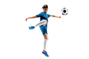 Image showing Young boy with soccer ball doing flying kick