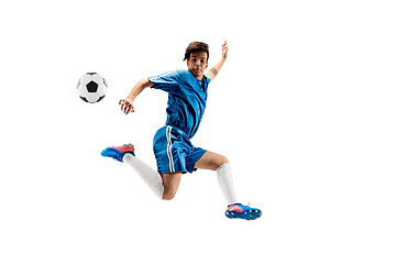 Image showing Young boy with soccer ball doing flying kick