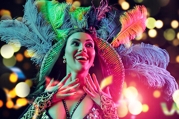 Image showing Beautiful young woman in carnival peacock costume