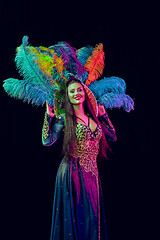 Image showing Beautiful young woman in carnival peacock costume