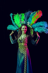 Image showing Beautiful young woman in carnival peacock costume