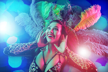 Image showing Beautiful young woman in carnival peacock costume