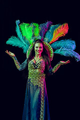 Image showing Beautiful young woman in carnival peacock costume