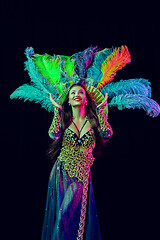 Image showing Beautiful young woman in carnival peacock costume