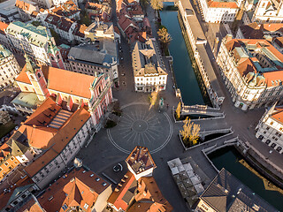 Image showing Aerial drone view of Preseren Squere and Triple Bridge over Ljubljanica river,Tromostovje, Ljubljana, Slovenia. Empty streets during corona virus pandemic social distancing measures