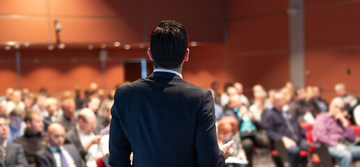 Image showing Public speaker giving talk at business event.