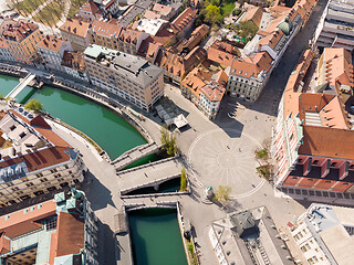 Image showing Aerial drone view of Preseren Squere and Triple Bridge over Ljubljanica river,Tromostovje, Ljubljana, Slovenia. Empty streets during corona virus pandemic social distancing measures