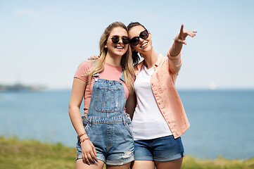 Image showing teenage girls or best friends at seaside in summer