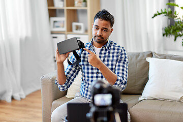 Image showing male blogger with vr glasses videoblogging at home