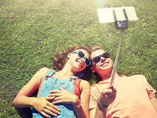 Image showing happy couple taking selfie on smartphone at summer